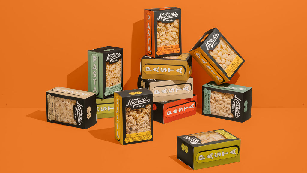 Nicolettos dried pasta packaging on orange backdrop